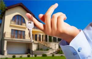 House owner/real estate agent giving away the keys